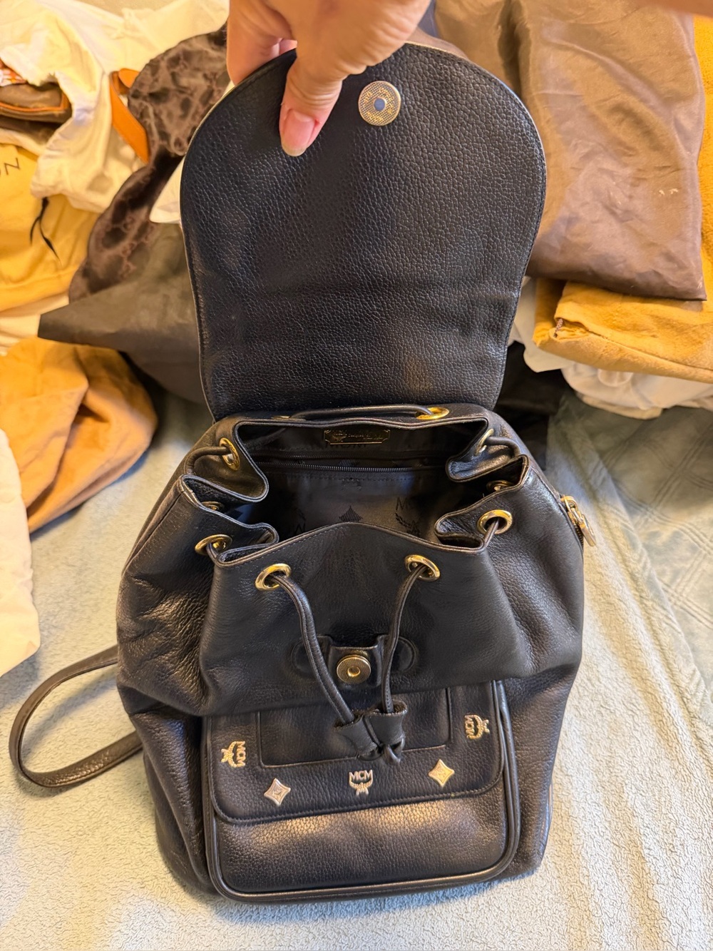 MCM Black Leather Drawstring Backpack with Gold Hardware